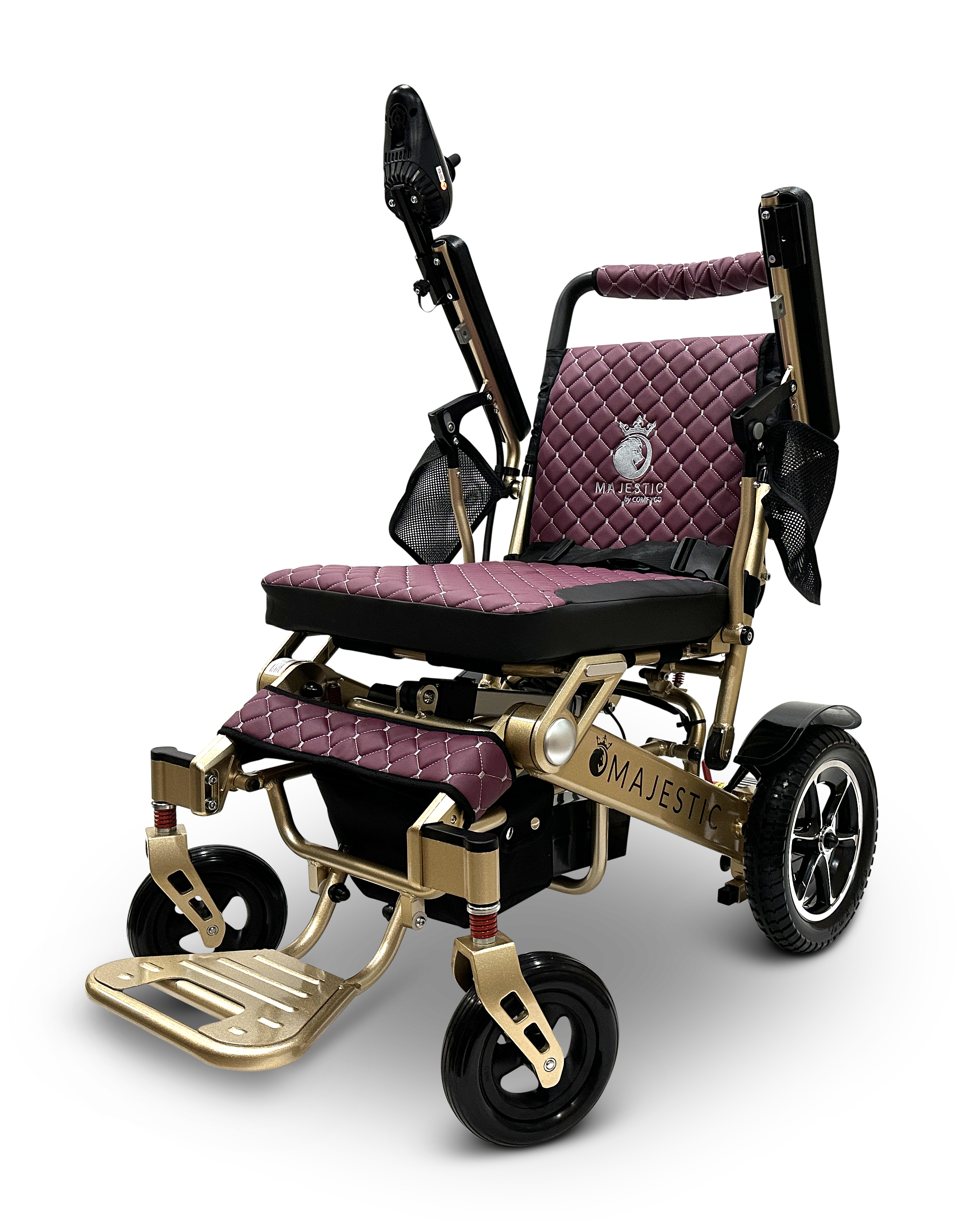 The MAJESTIC IQ-7000 Remote Controlled Electric Wheelchair boasts a luxurious design with quilted burgundy cushions and a golden frame. It features a joystick control on the armrest, a footrest, and sturdy wheels, proudly displaying "Majestic" on its side.